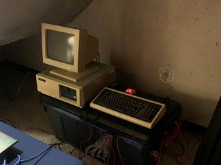 A beige desktop computer with a malfunctioning display
